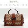 COACH STUDDED FLAP SLING BAG